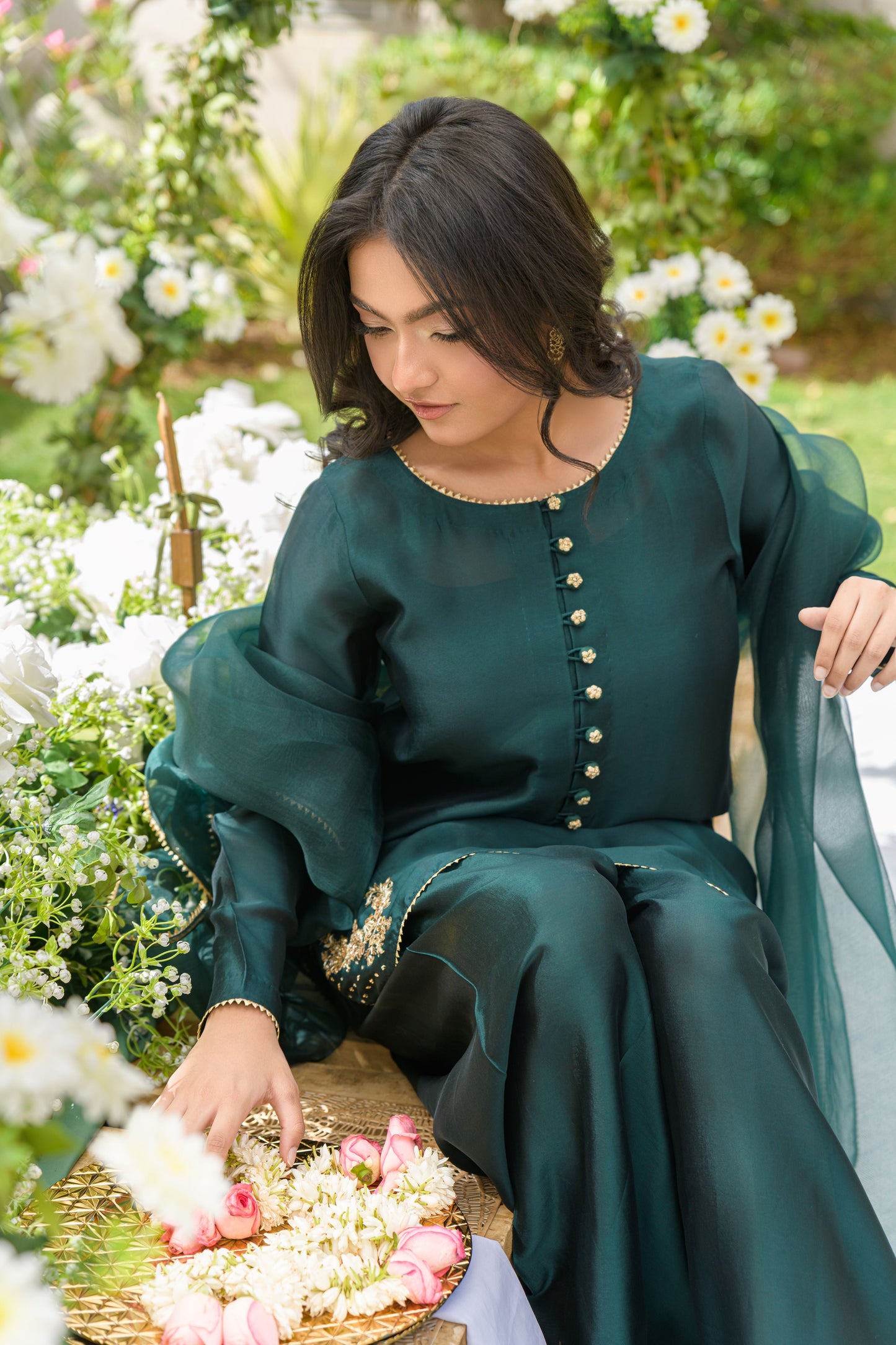 Zamurad Elan - deep green sheesha silk farshi shalwar suit with gold zardozi sitting pose by Alishba Kashif