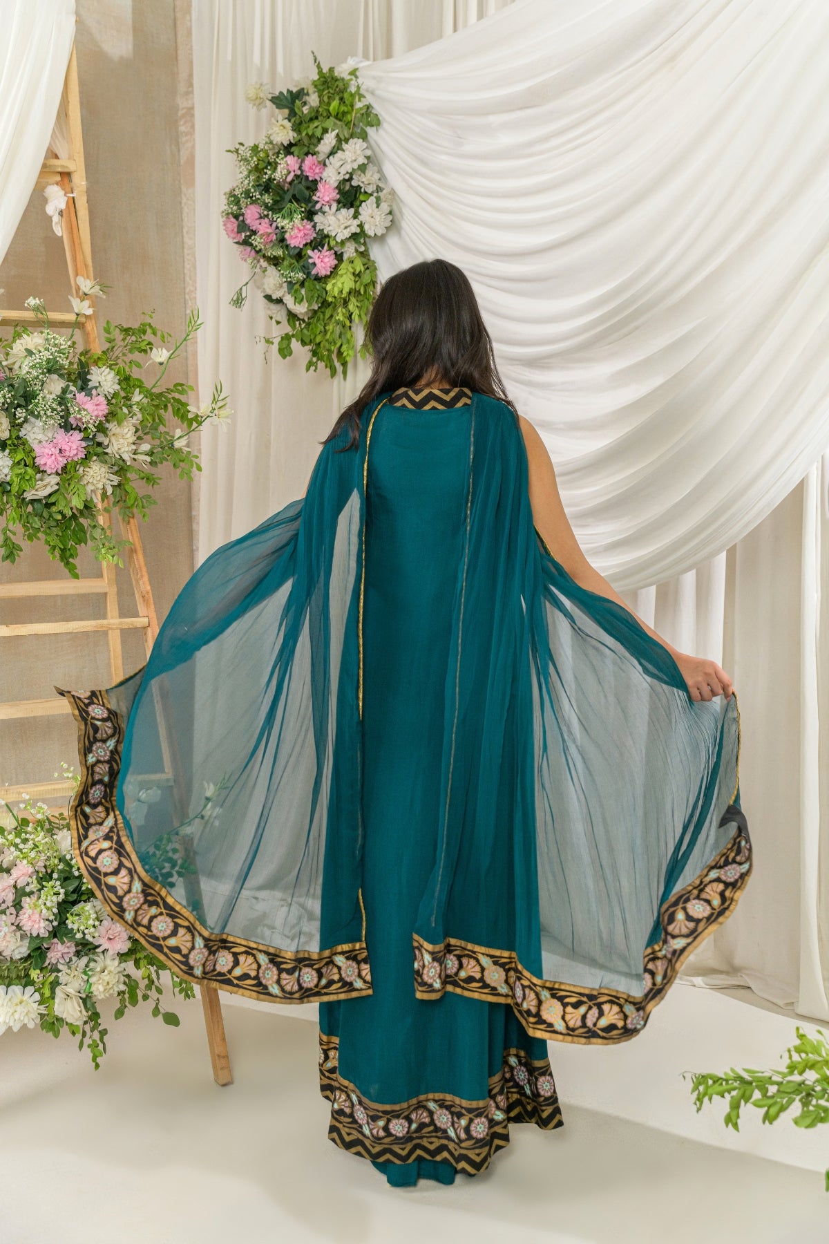 Nyra - teal green embroidered formal dress back view by Alishba Kashif