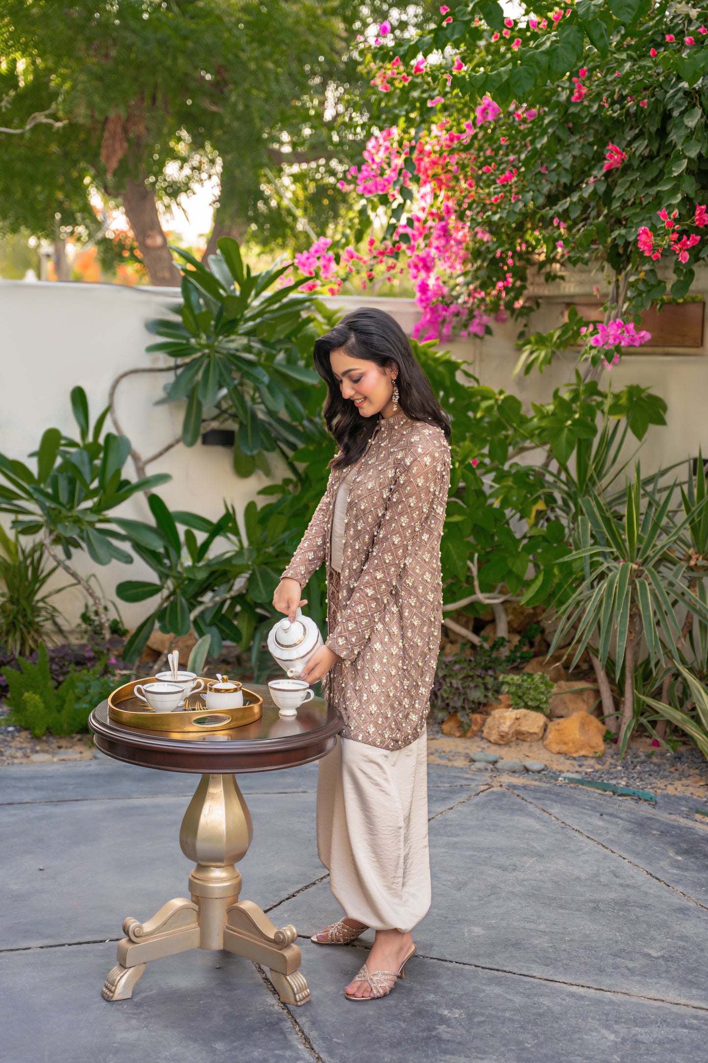 Taupe Éclat - brown embroidered formal outfit garden pose by Alishba Kashif