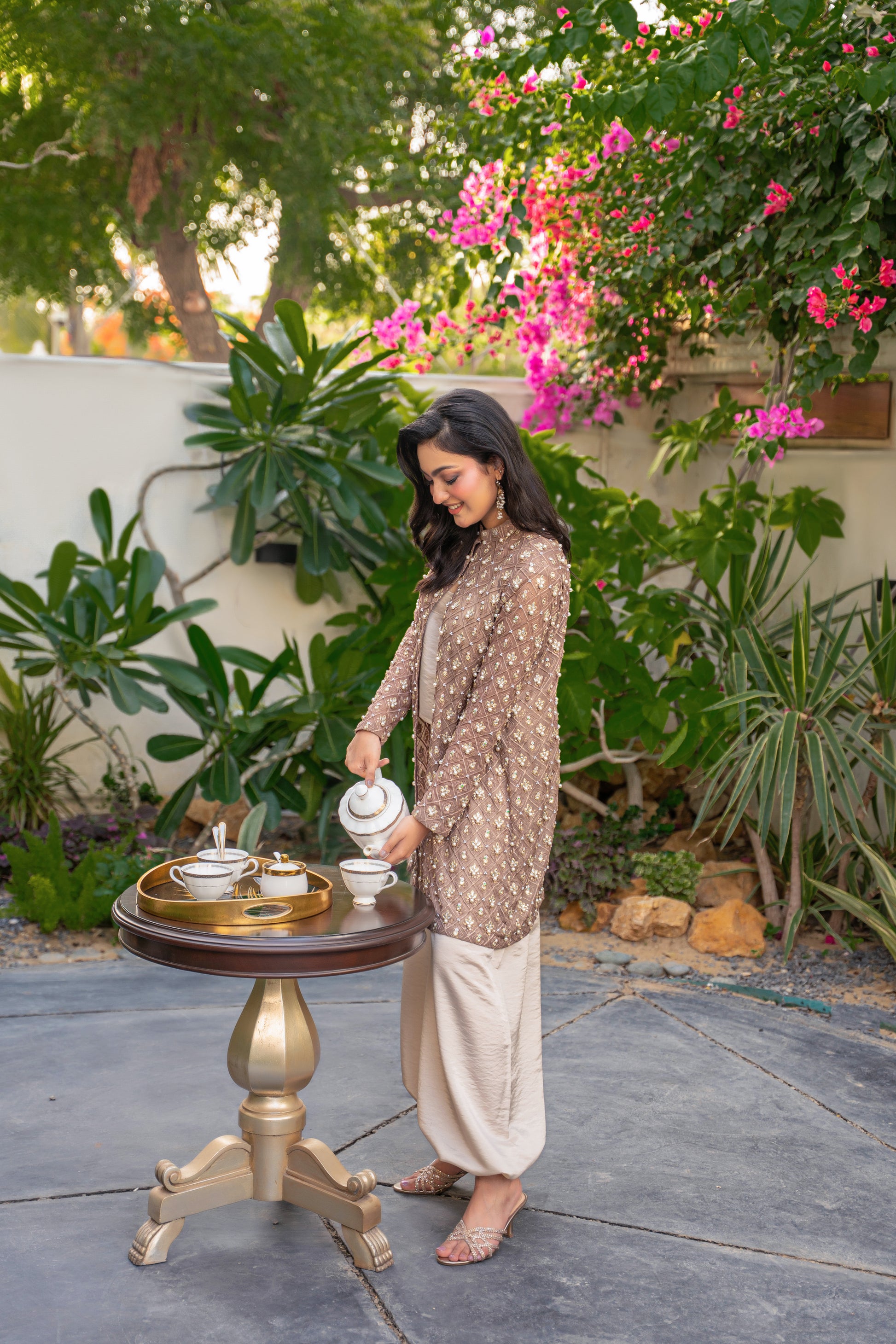 Taupe Éclat - brown embroidered formal outfit garden pose by Alishba Kashif
