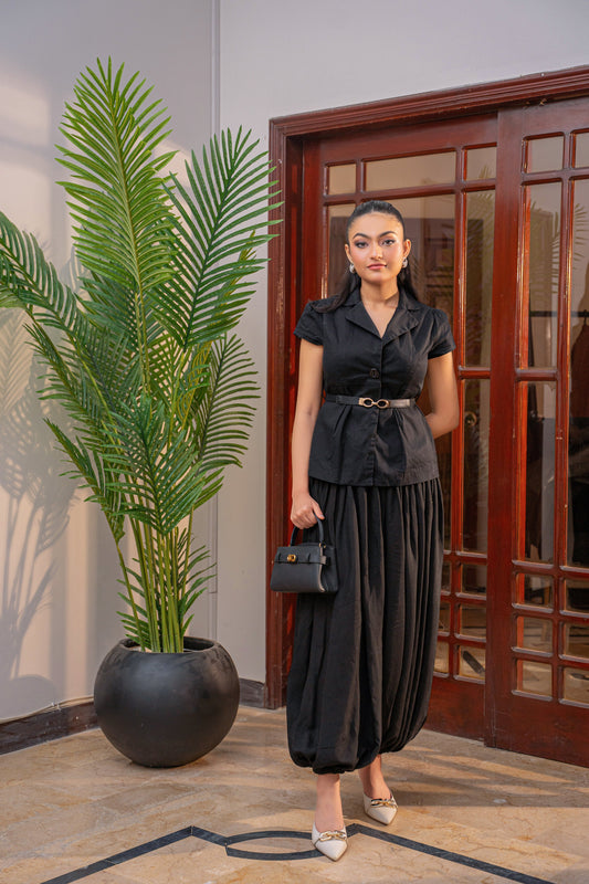 Luna Noir black coord set by Alisho - model holding bag, full length