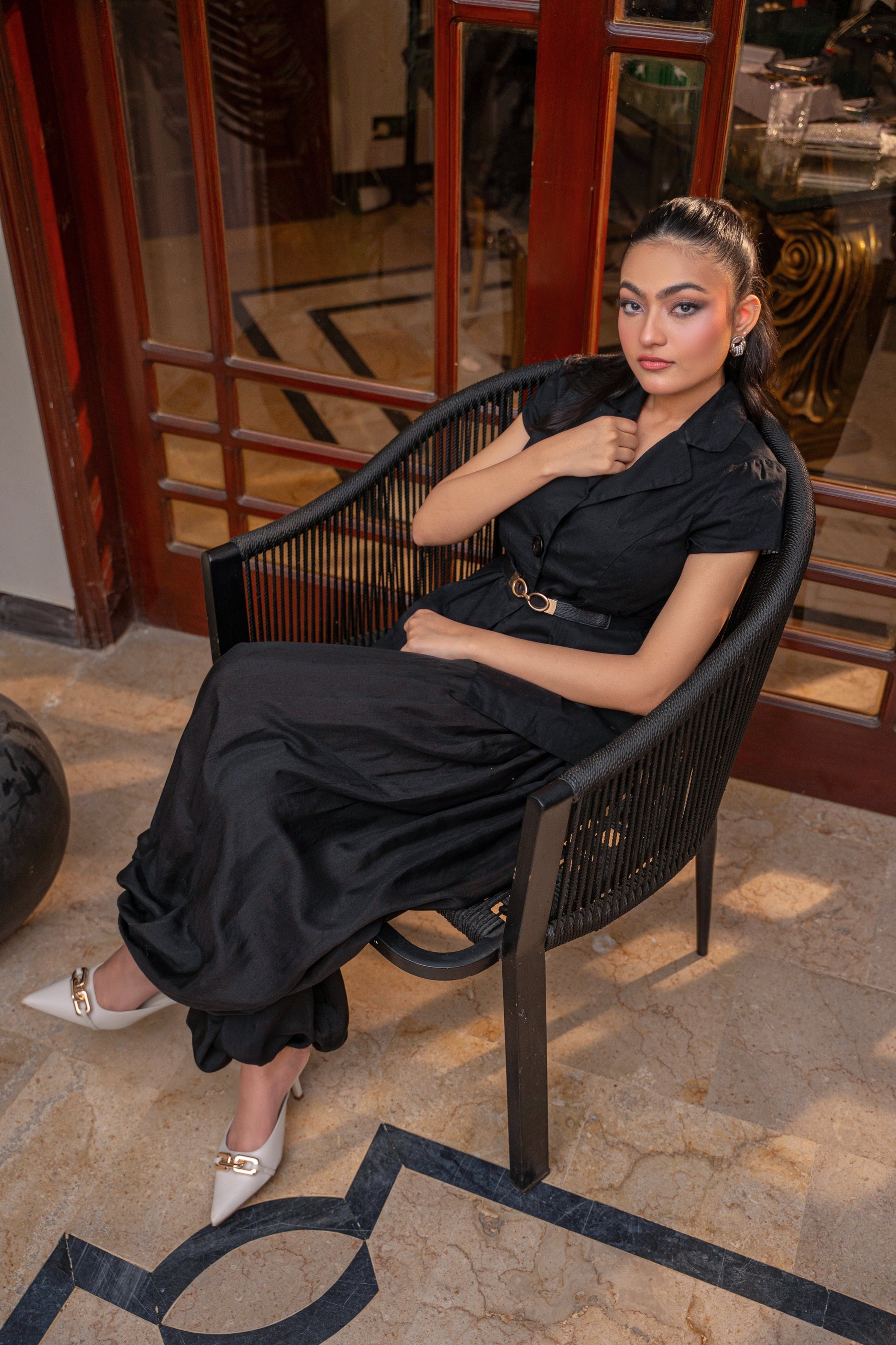 Luna Noir black balloon pants silhouette by Alisho - model seated, editorial view 