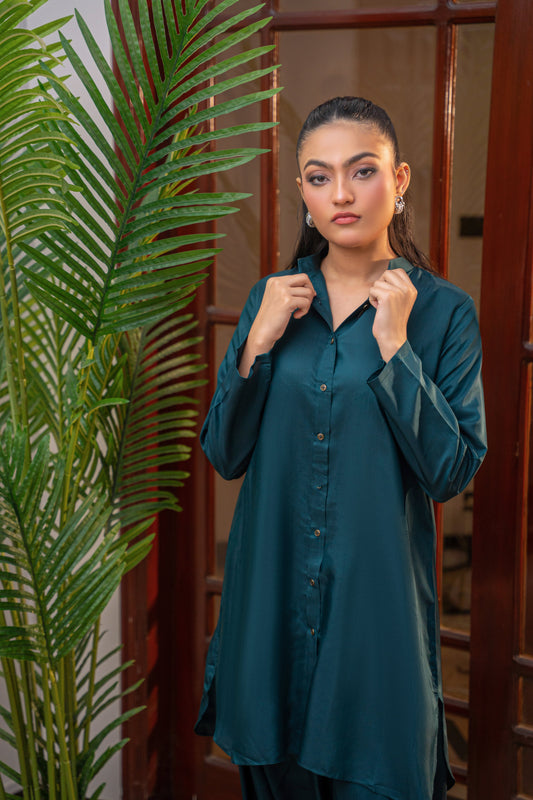 Deep Serenity teal viscose shirt by Alisho - model holding collar, front facing.