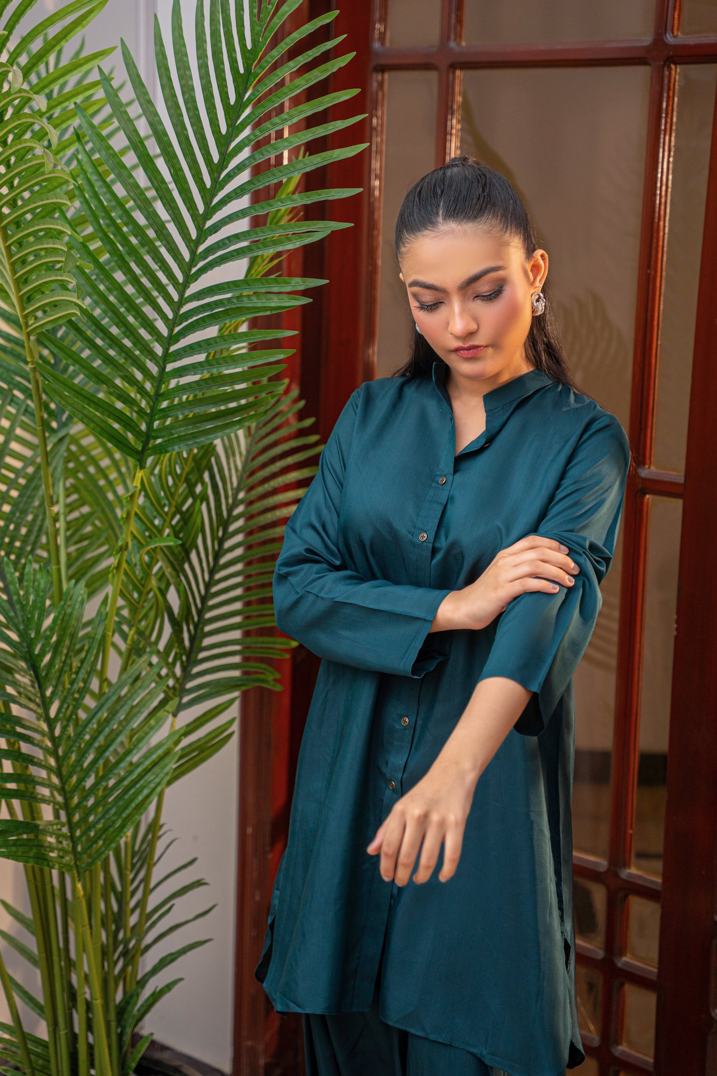 Deep Serenity teal viscose shirt by Alisho - model looking down, rekaxed pose