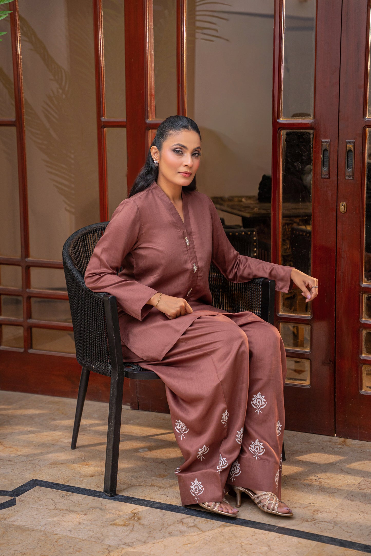 Mocha Muse farshi shalwar with block print by Alisho - model seated, full outfit view