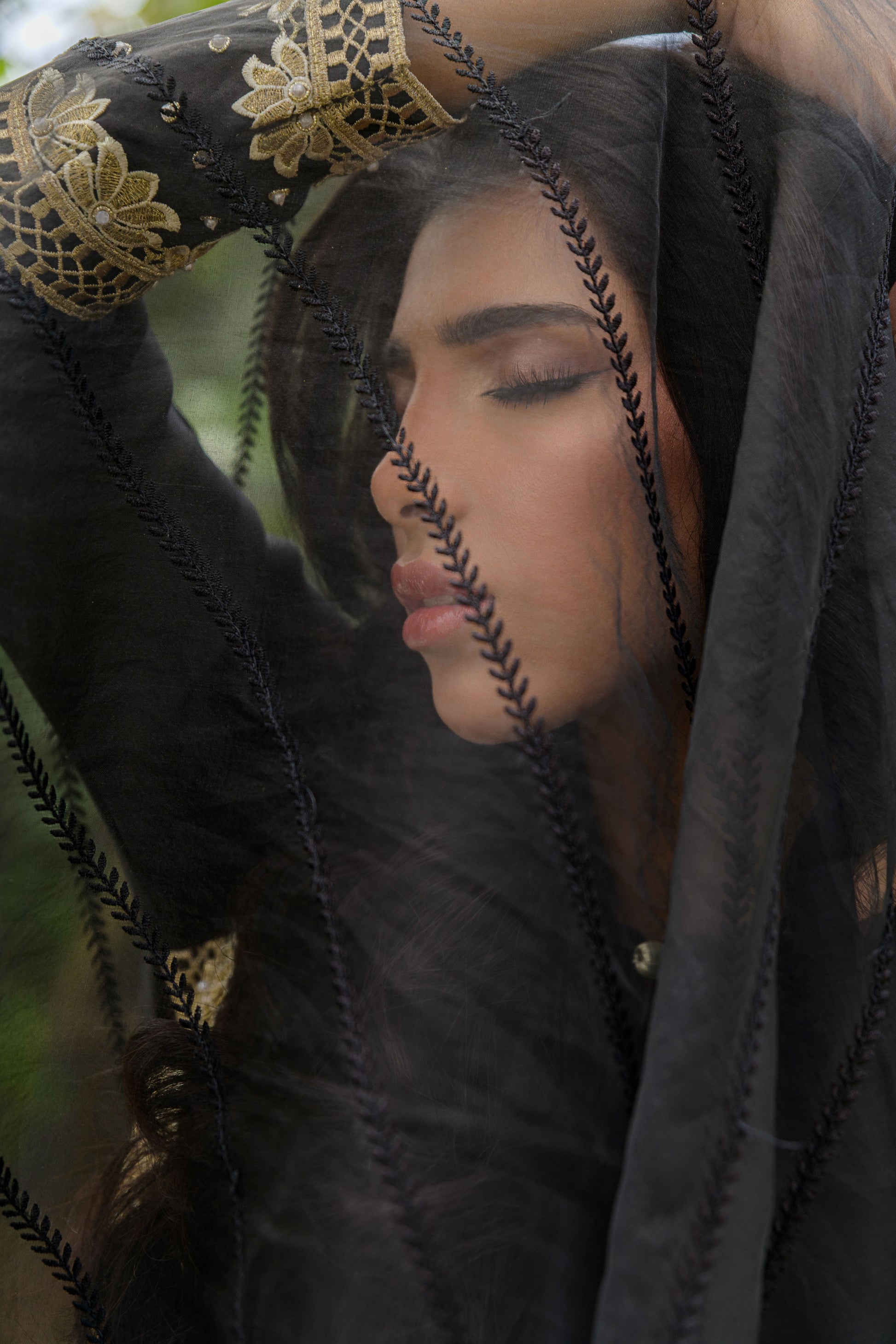 Noir Elegance - black sheesha silk suit with ivory lace border dupatta pose by Alishba Kashif