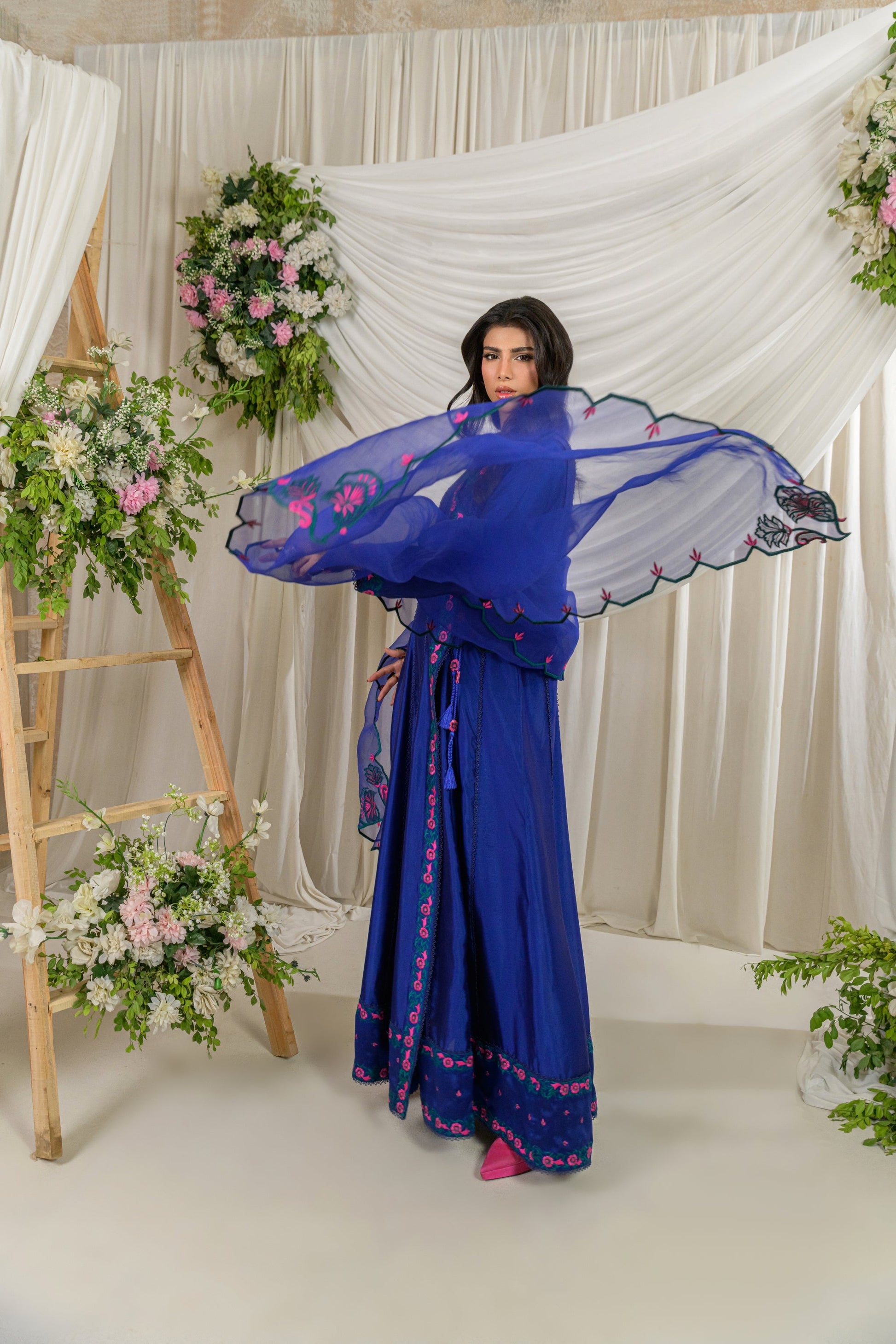 Meherbano - cobalt blue angrakha full length side view by Alishba Kashif