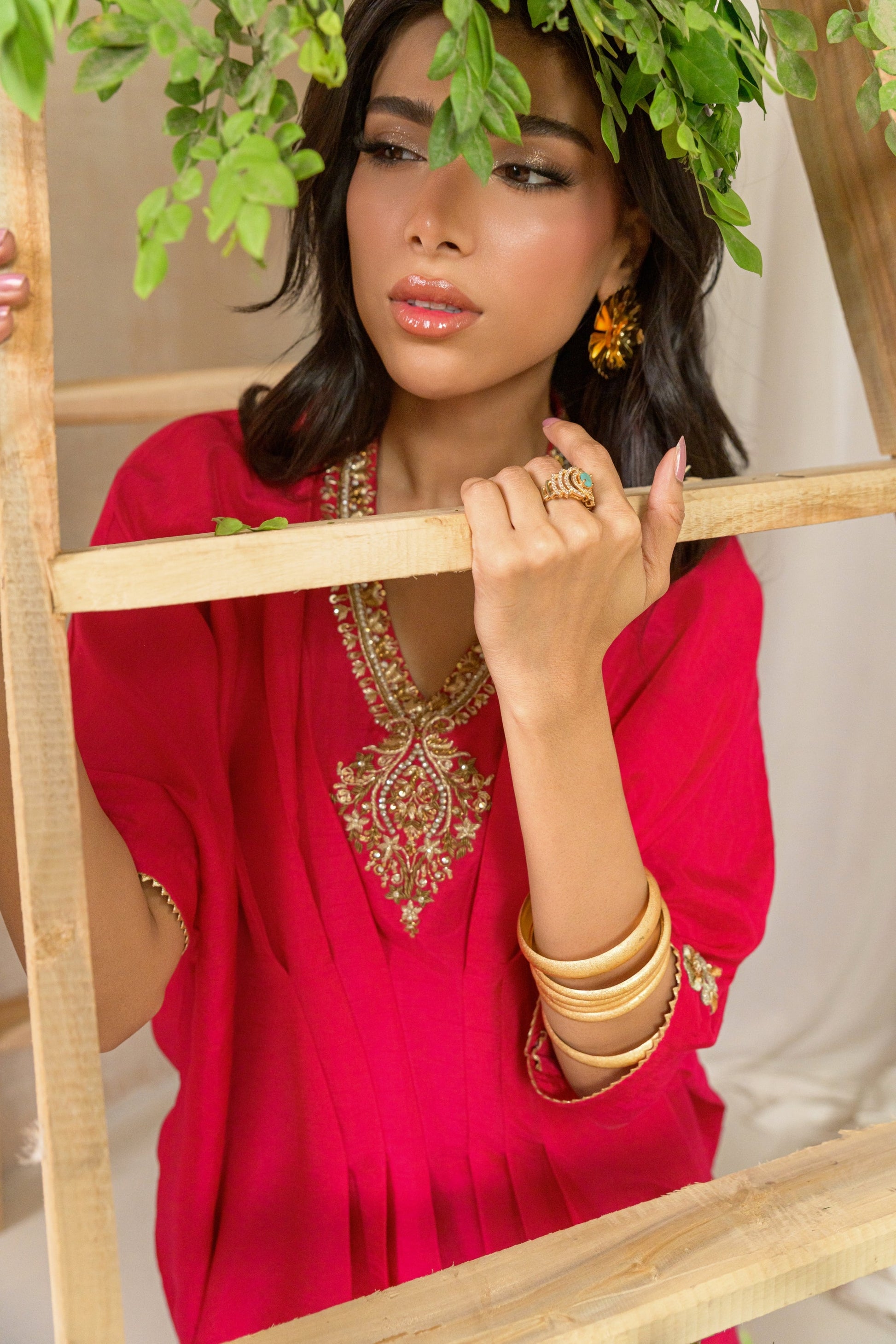 Gulnar - pink Korean raw silk kaftan with gold dabka work detail view by Alishba Kashif