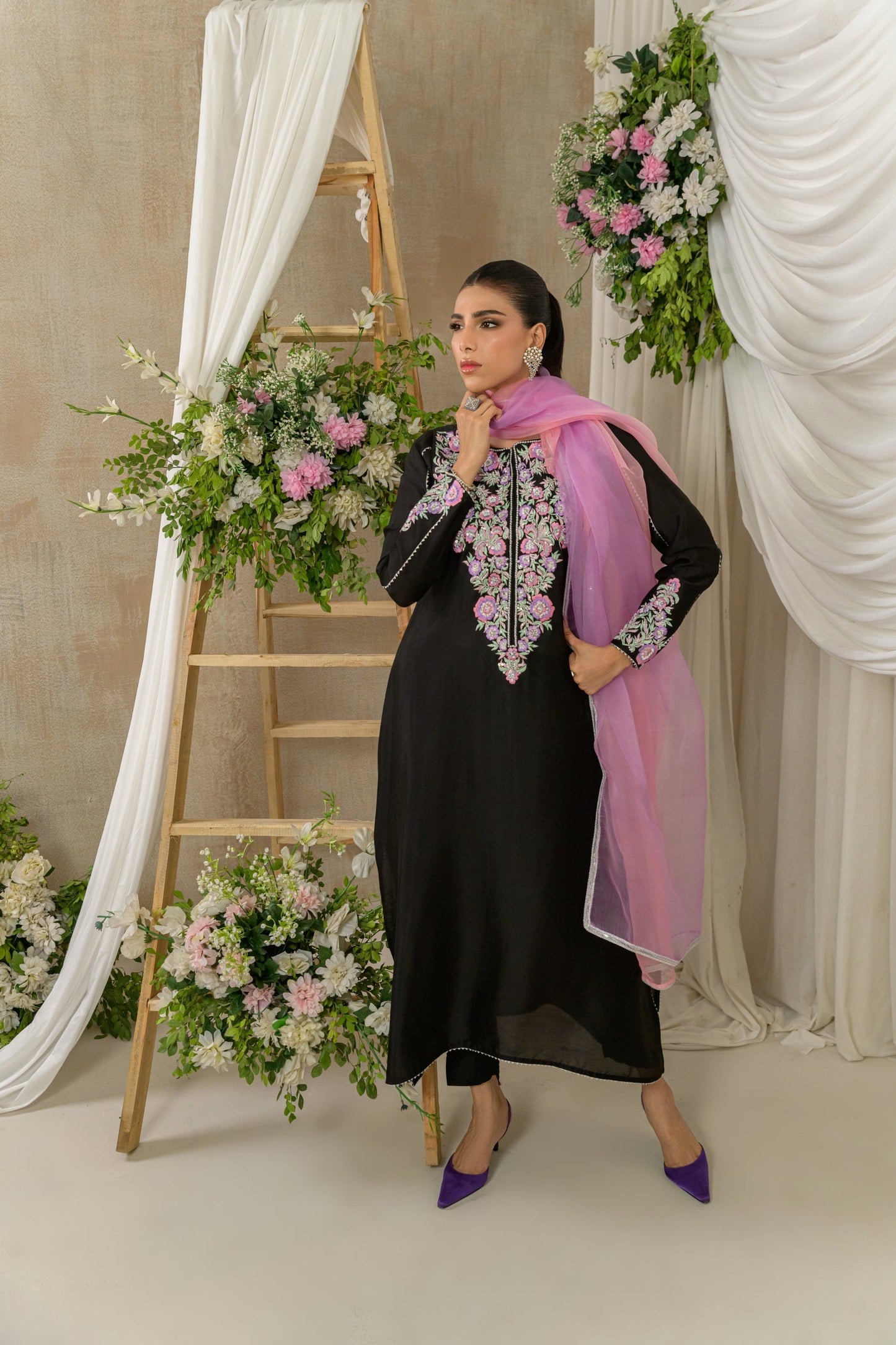 Midnight Petals - black floral embroidered outfit with pink dupatta pose by Alishba Kashif