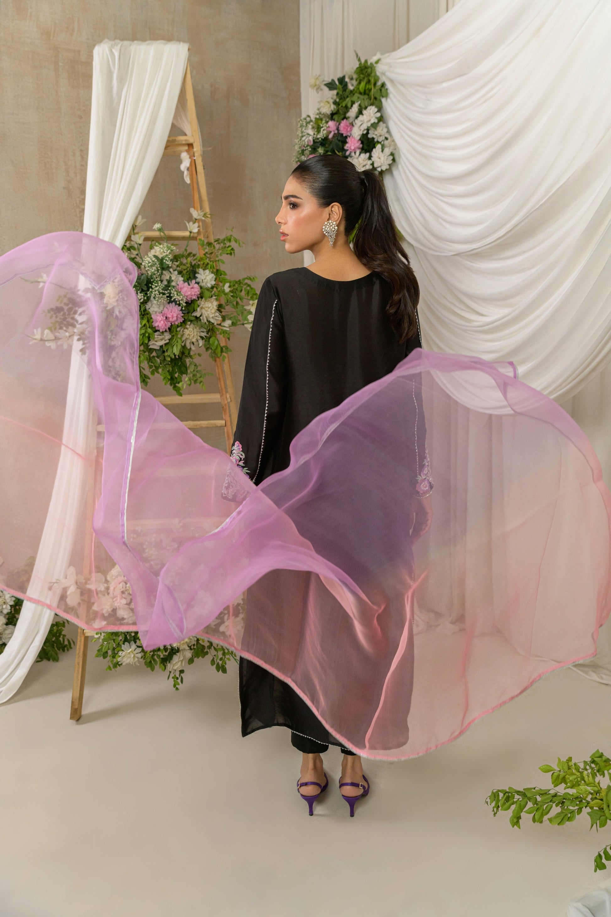 Midnight Petals - black floral embroidered outfit with pink dupatta pose by Alishba Kashif