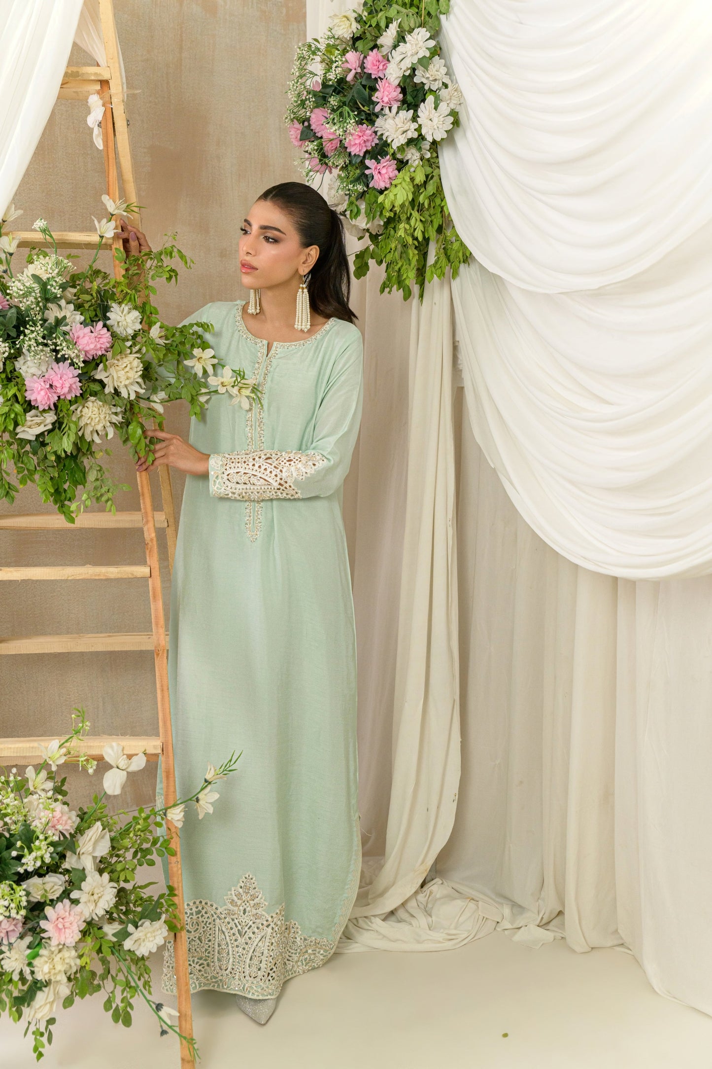 Mist - soft green silk kaftan with cutwork embellishments front view by Alishba Kashif