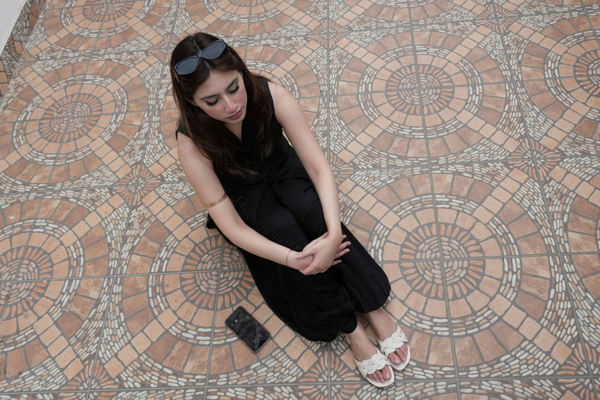 Alisho after dark black sleeveless top and balloon pants in a lifestyle setting