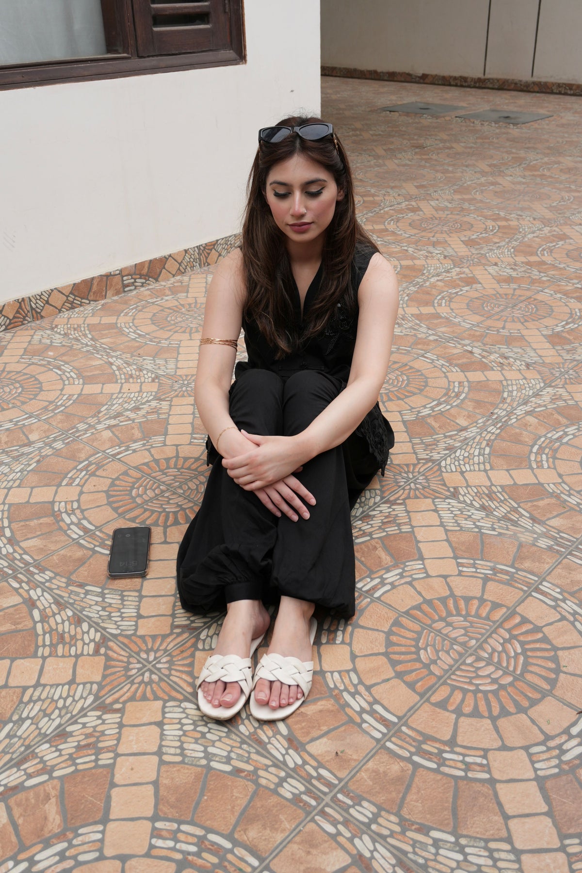 Alisho After Dark black sleeveless top and balloon pants worn by a model