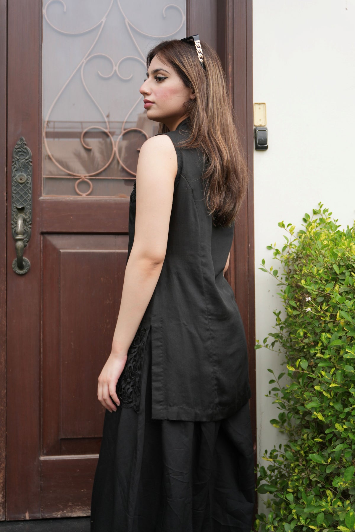 Alisho After Dark black sleeveless top and balloon pants back view