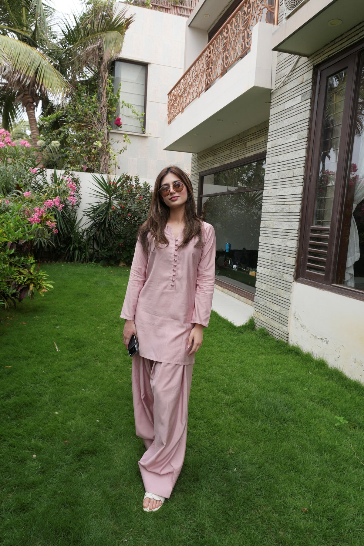 Alisho Blush Rush blush pink kurta and farshi shalwar set worn outdoors