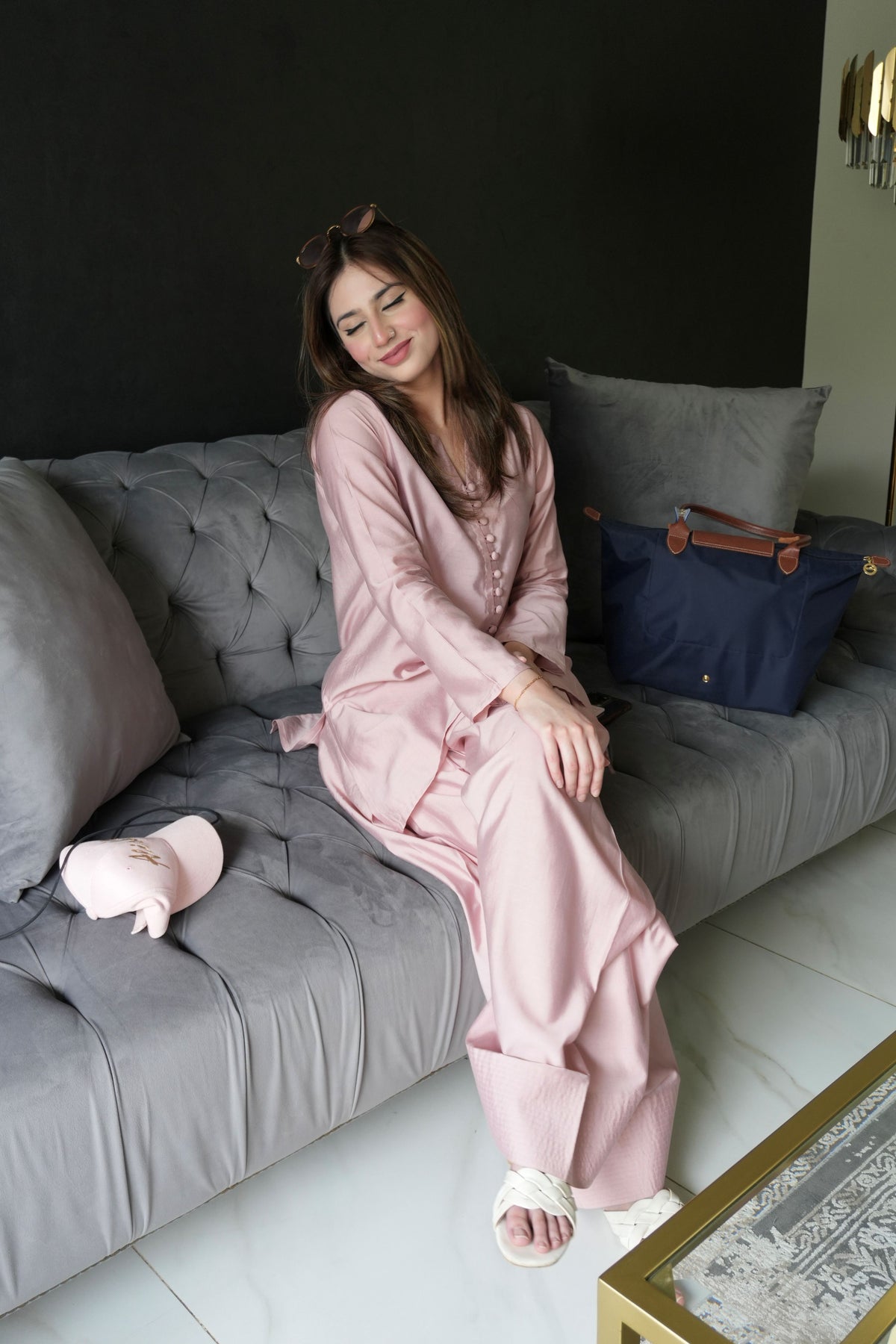 Alisho Blush Rush blush pink kurta and farshi shalwar set worn by a model seated on sofa