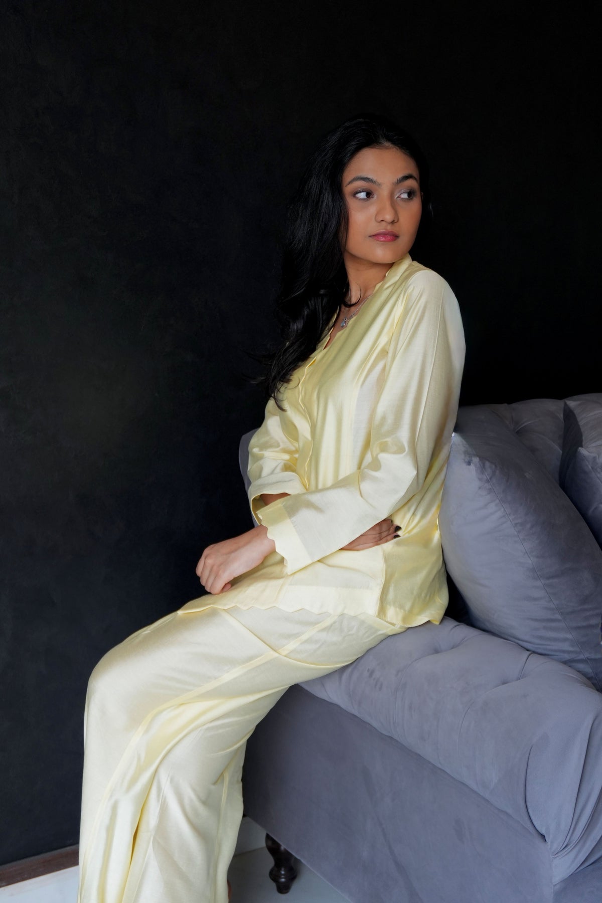 Alisho Buttercream shirt and bootcut pants set worn by a model