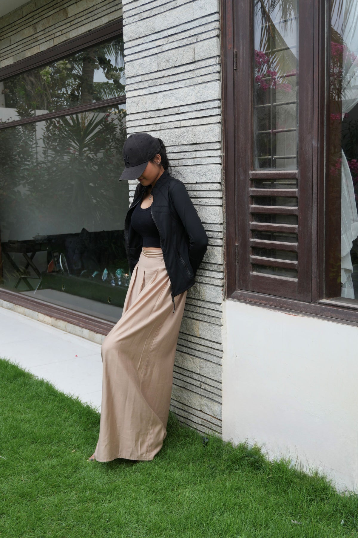 Alisho Oat milk wide-leg pants worn in a garden setting