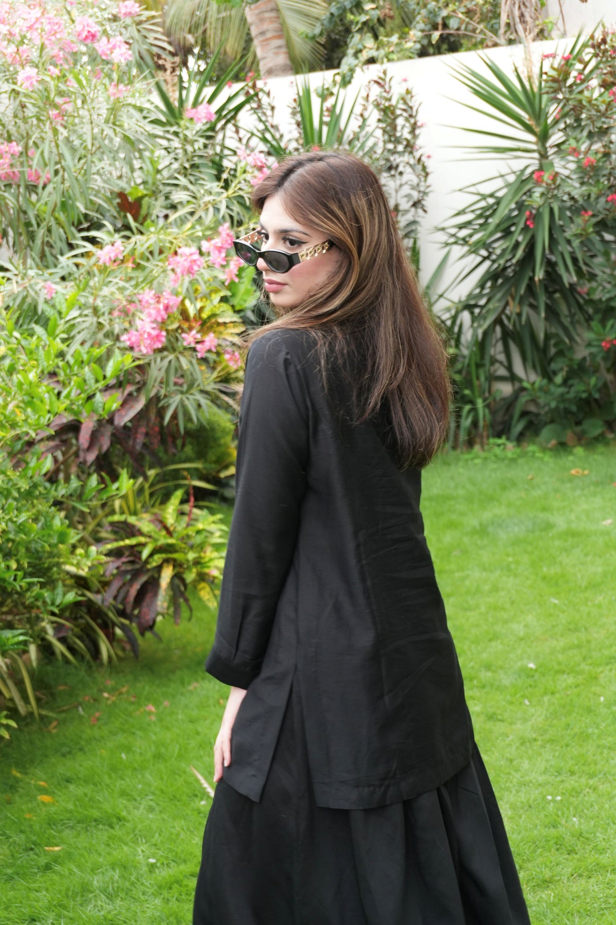 Alisho Offscript black top with button detailing and balloon pants back view