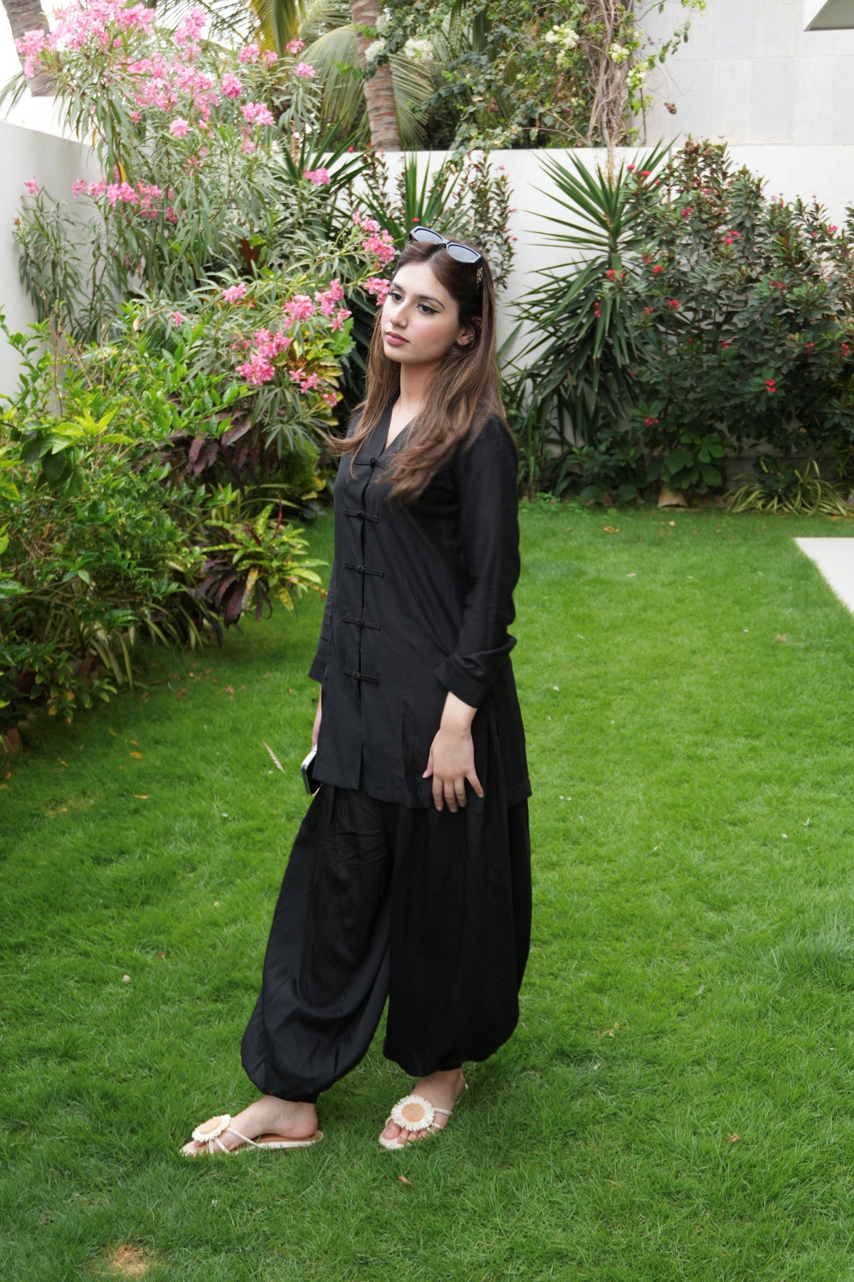 Alisho Offscript black top with button detailing and balloon pants, front view