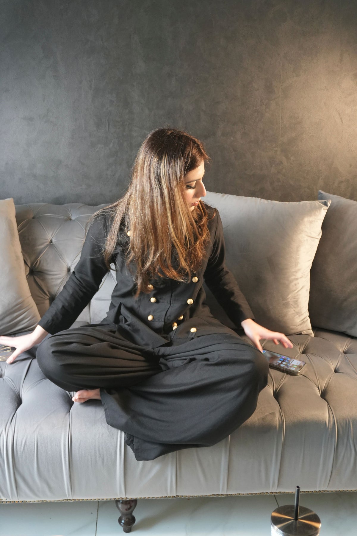 Alisho Power Play black Mandarin collar top and wide leg pants indoor seated 
