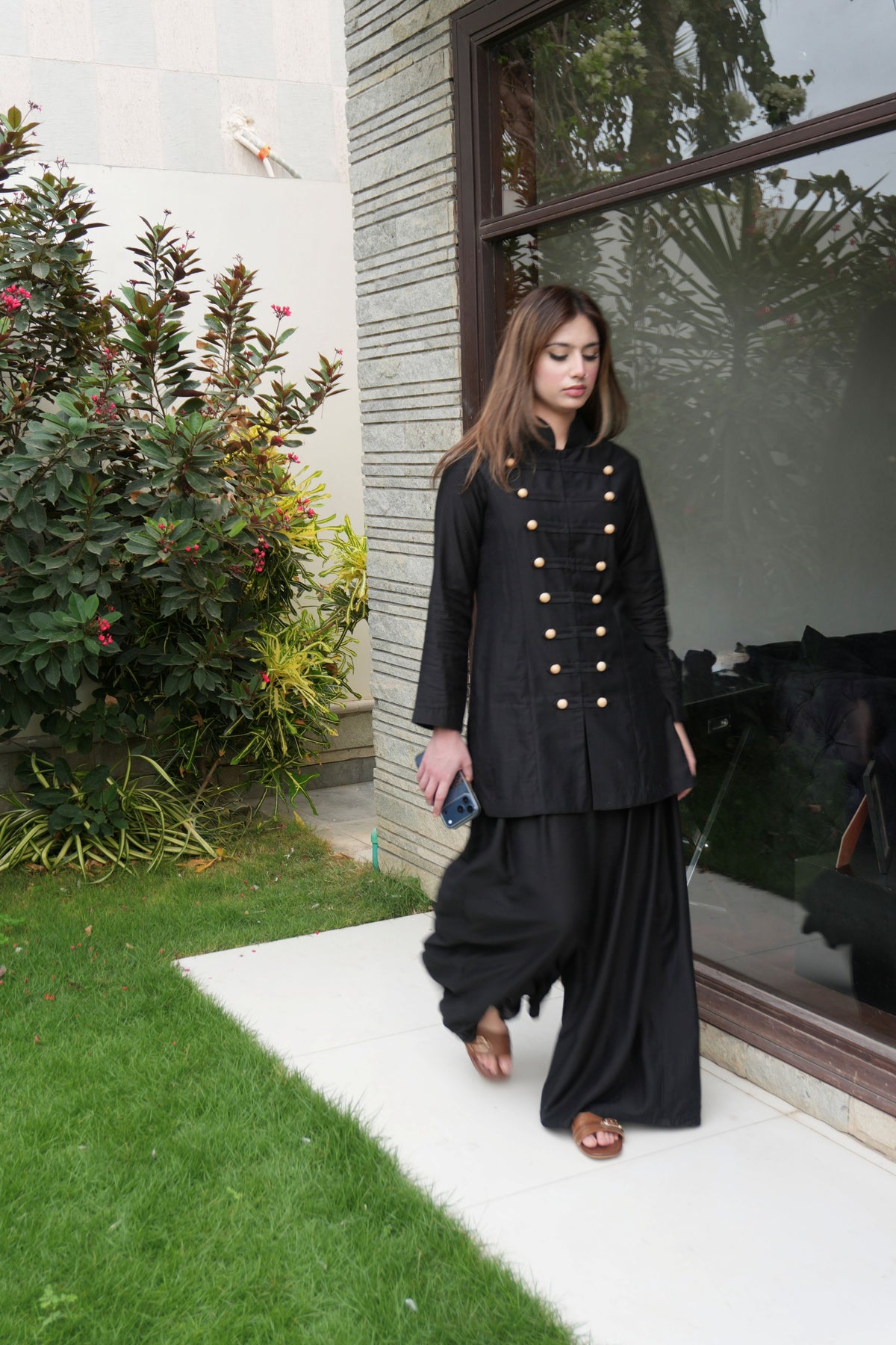 Alisho Power Play black Mandarin collar top and wide leg pants worn by a model outdoors